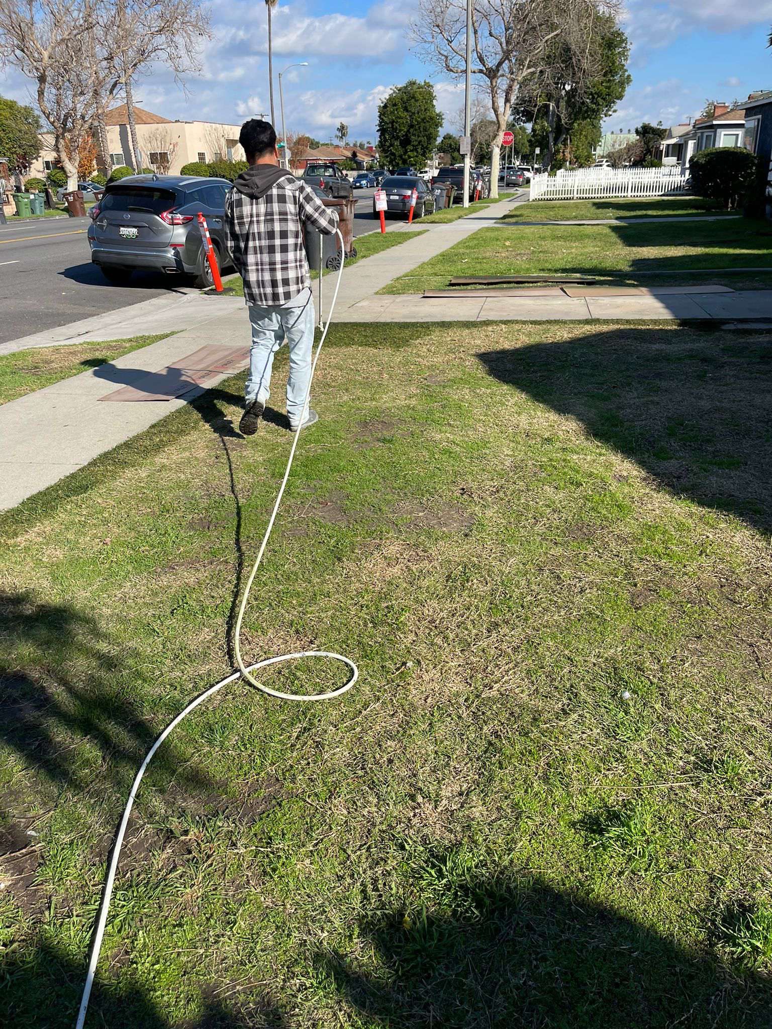 man painting a lawn